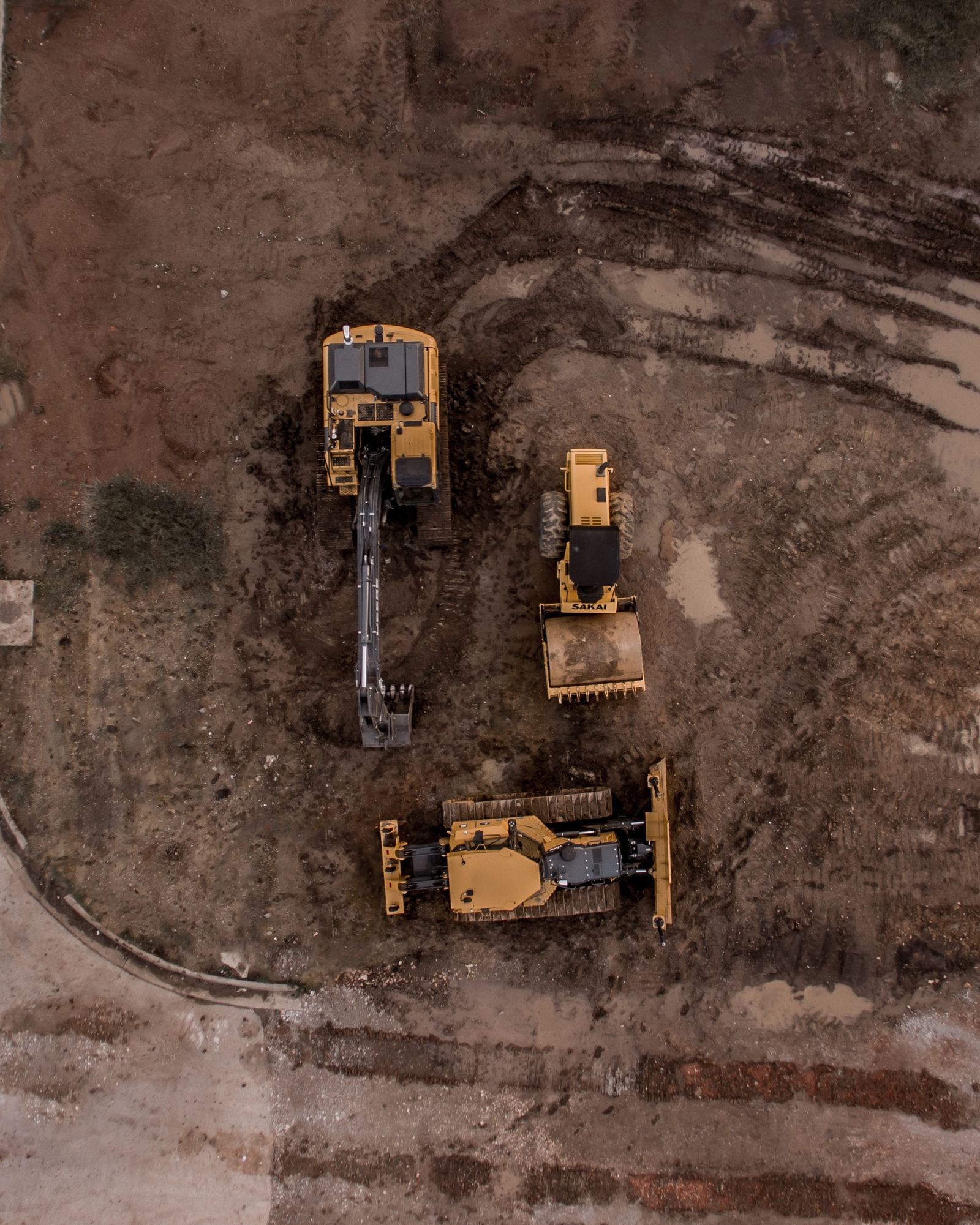 Excavator and bulldozer working together on a demolition and earthmoving site