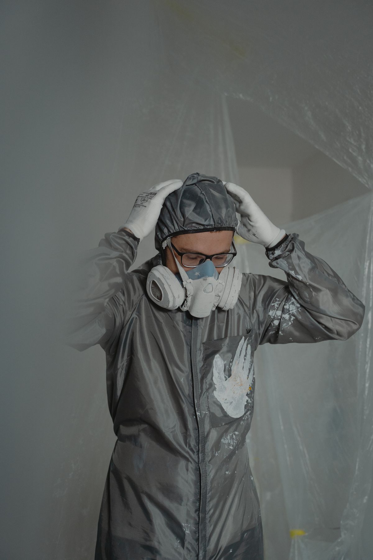 Worker wearing protective equipment and a mask