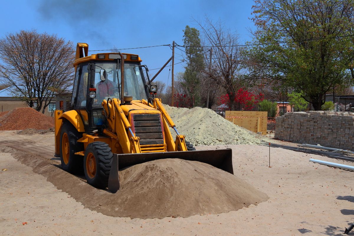 Loader clearing material at a construction site